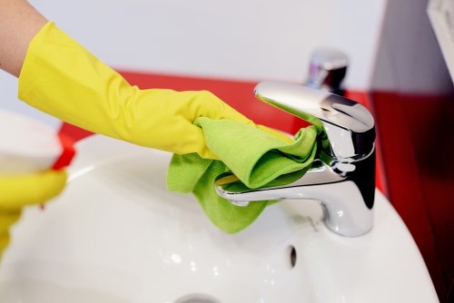Technician treating a pet urine stain in a Notting Hill carpeted flat