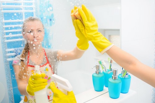 Cleaner preparing equipment and checking a property before service starts